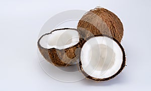 Split and whole coconut on a white background. Coco, ripe palm fruit