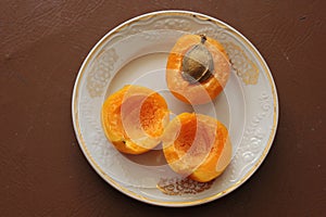 Splitted apricots, one half is with stone