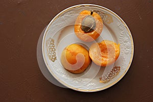 Splitted apricots on the saucer