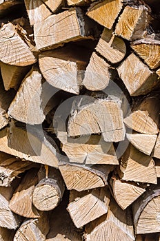 Splitted, dried and stacked firewood, vertical