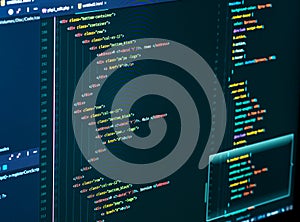 Splitting of html and css in the code editor on the monitor, close up. Web Design and Web development