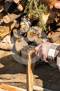 Splitting wood with hunting knife