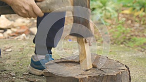 Splitting wood on a stump