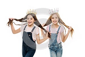 Spoiled children concept. Egocentric princess. Kids wear golden crowns symbol princess. Every girl dreaming become