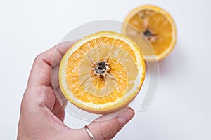 Spoiled orange. The black middle inside the fruit