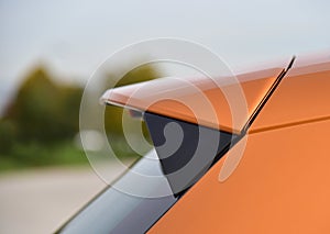 Spoiler at the end of the roof of a passenger car photo