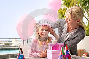 Spoiling her princess. A cropped shot of a happy little girl celebrating her birthday with her mom.