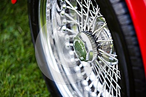 Spoked shiny wheel in classic car