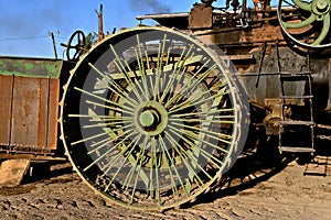 Spokes of an old steam engine wheel