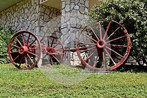 Spokes of an old wood wagon wheekl show deterioration