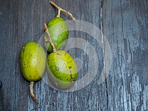 Spondias mombin on black wooden background