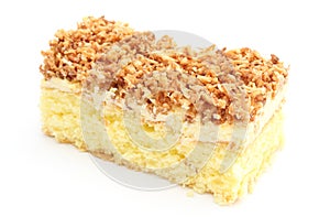 Sponge cake with cream and coconut. White background