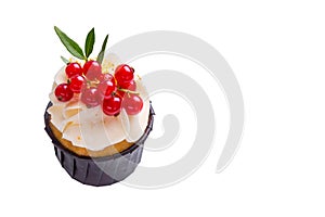Sponge cake with cream and red currant on a white isolated background.