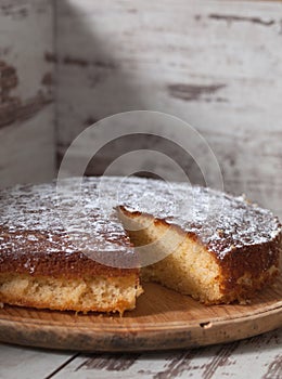 Sponge cake of lemon over wooden background