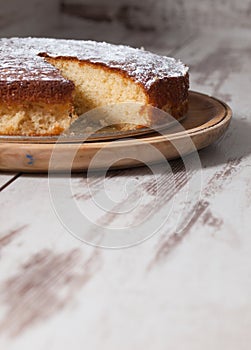 Sponge cake of lemon over wooden background