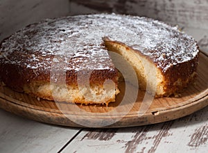 Sponge cake of lemon over wooden background