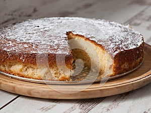 Sponge cake of lemon over wooden background