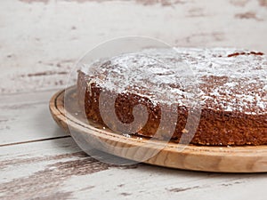 Sponge cake of lemon over wooden background