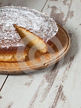 Sponge cake of lemon over wooden background