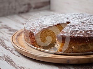 Sponge cake of lemon over wooden background