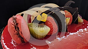 Sponge pieces on a table neatly arranged, served to visitorsStrawberry mousse cake served with topping strawberries, kiwi fruit an