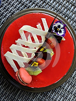 Sponge pieces on a table neatly arranged, served to visitorsStrawberry mousse cake served with topping strawberries, kiwi fruit an