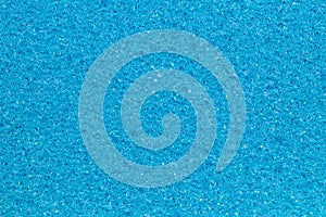 Sponge texture background. Close-up of blue bath sponge texture with porous structure for background. Macro photo
