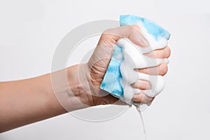 Sponge for washing dishes in hand