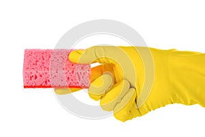 Sponge for washing dishes in a hand in a yellow rubber glove. The concept of cleanliness and cleaning