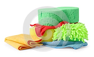 Sponges, cloths and car wash mitt on white background