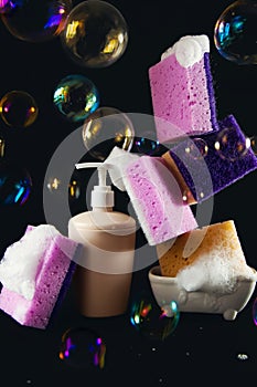 Sponges for washing dishes, detergent and soap bubbles