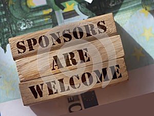 SPONSORS are WELCOME Know Your Worth on wooden blocks pur on 100 Euro banknotes. Sponsorship donation support business