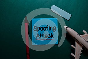 Spoofing Attack write on a sticky note isolated on Office Desk
