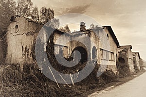Spooky abandoned houses. VIntage toned image.