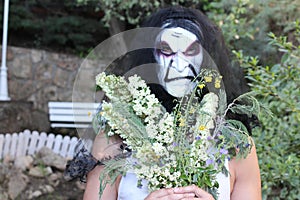 Spooky bride holding a bouquet