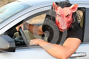 Spooky driver wearing a mask
