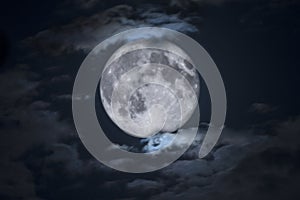 Spooky Full Halloween Moon Framed by Clouds photo