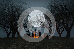 Spooky graveyard with full moon background
