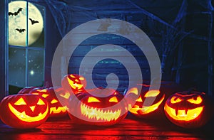 Spooky halloween background. scary pumpkin with burning eyes and