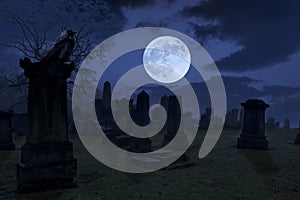 Spooky night at cemetery with old gravestones, full moon and black raven