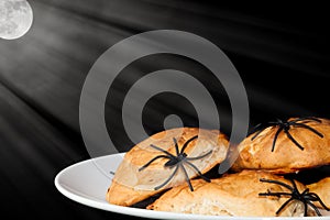 Spooky night trick or treat halloween food. Spider covered snack