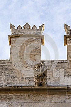 Spooky ornaments along the battlements of the silk trading building `Llotja de la Seda` in Valencia, Spain photo