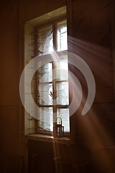 Spooky window with lantern and spider web