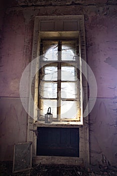 Spooky window with lantern and spider web