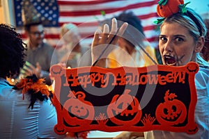 Spooky woman in costumes at Halloween Party