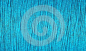 Spool of blue thread macro background