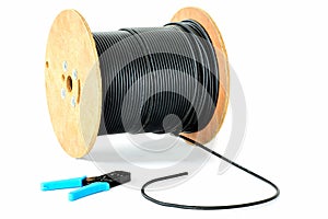 Spool of cable and plier photo