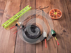 Spool of fishing line, floats and a box of hooks