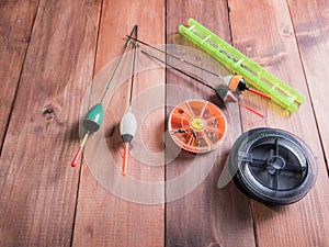 spool of fishing line, floats and a box of hooks