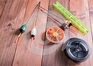 Spool of fishing line, floats and a box of hooks